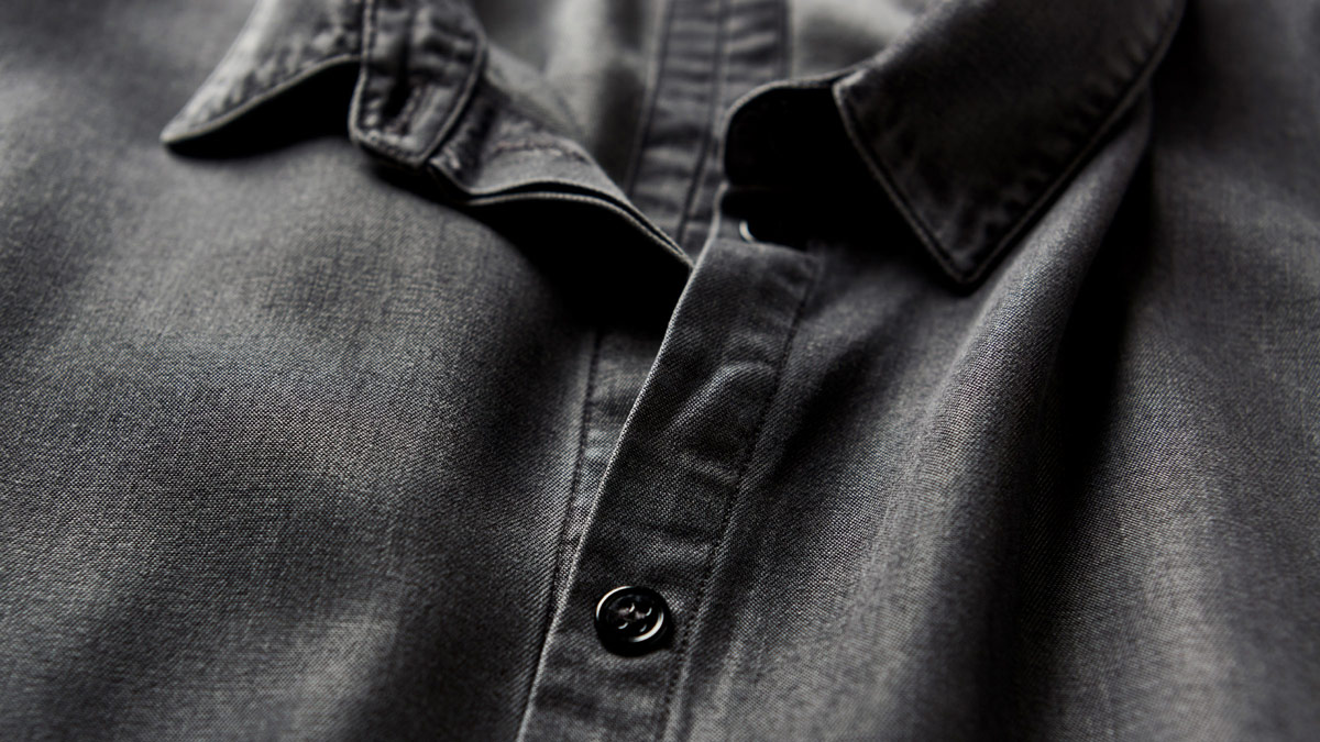 Close up of a dark grey dress shirt