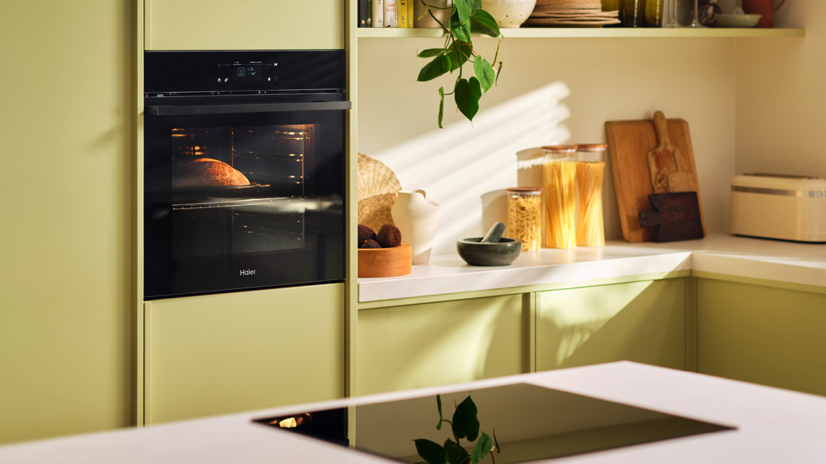 an interior kitchen showing a walloven and cooktop