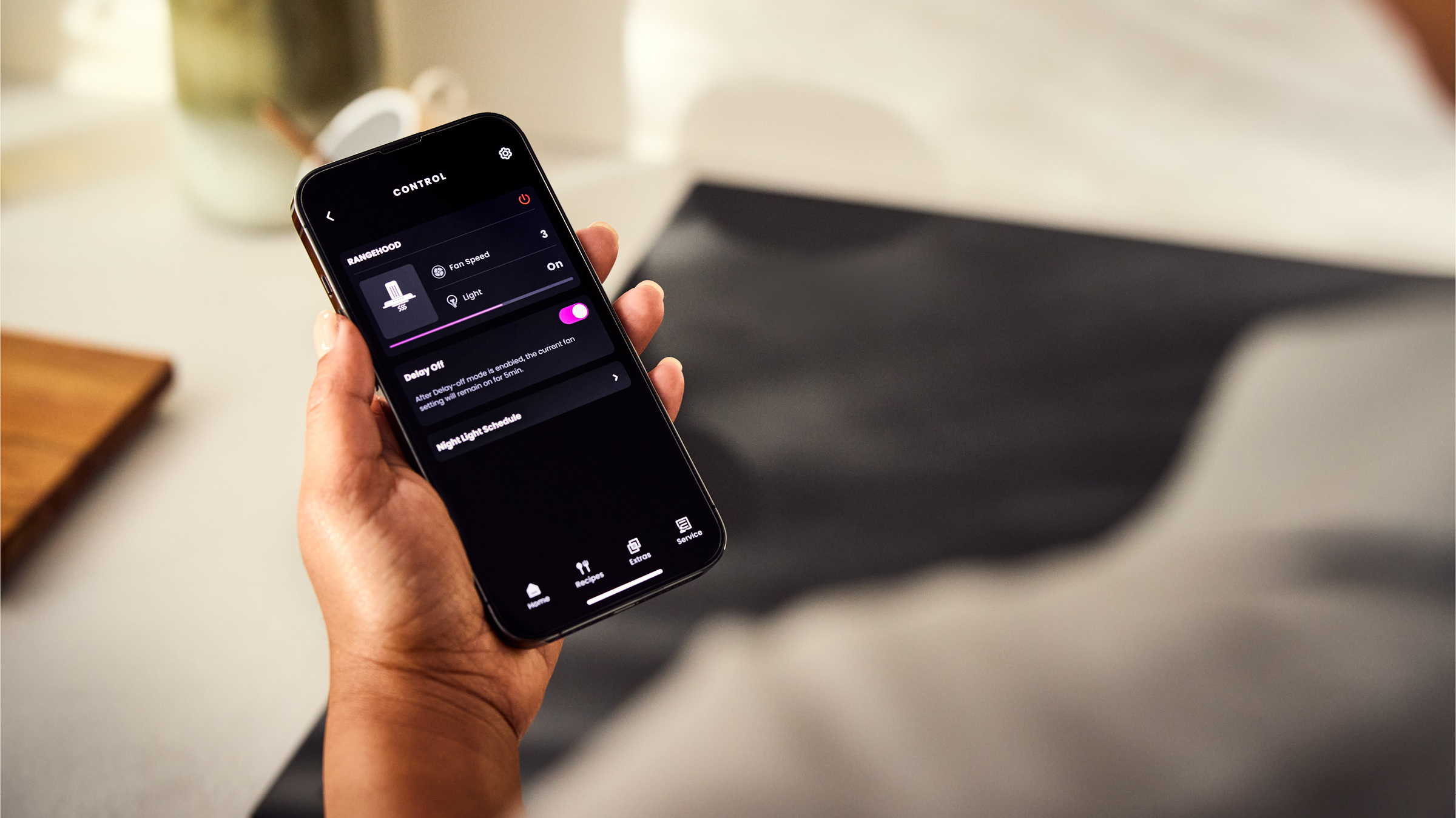 Person using SmartHQ app on smartphone