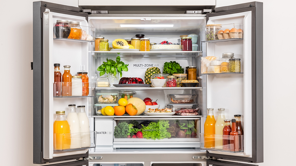 A fully stocked french door refrigerator with open doors