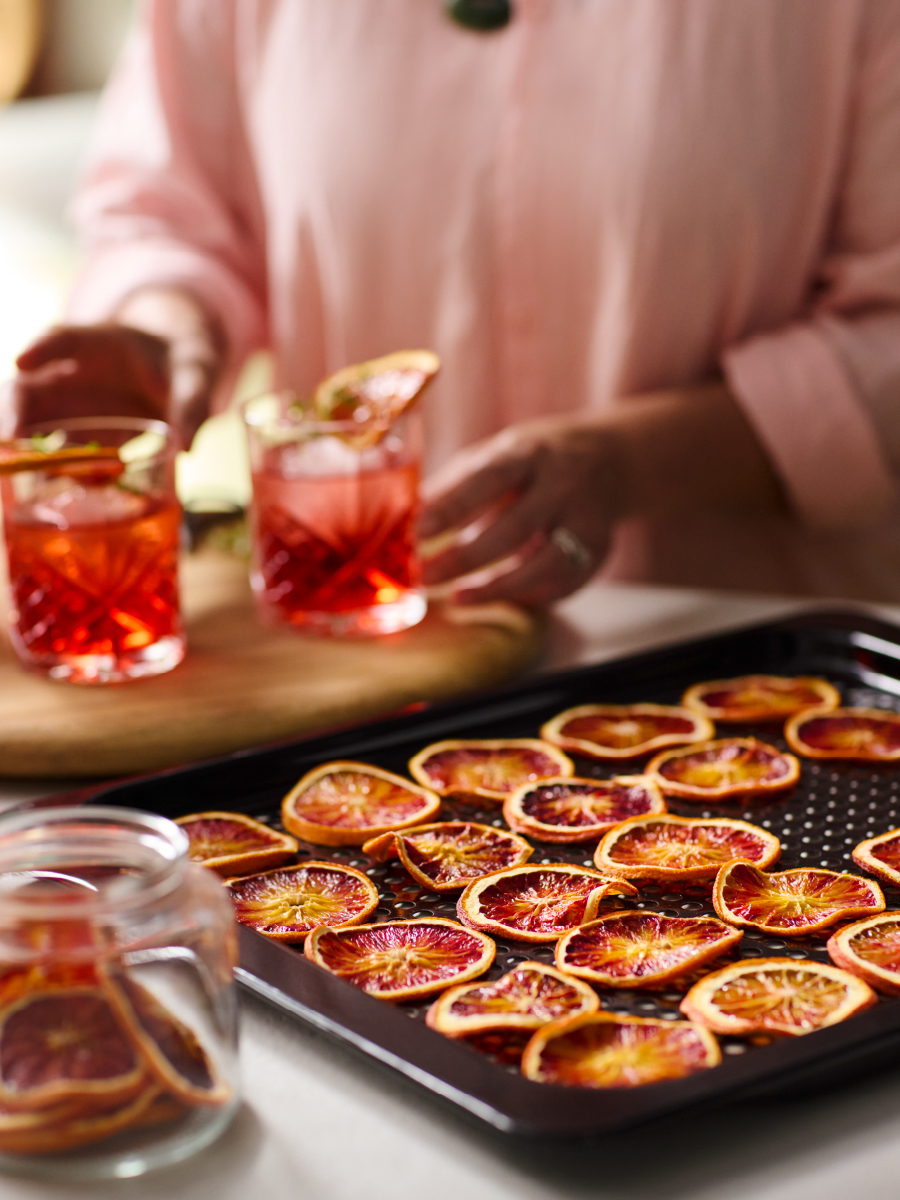 Dried oranges on tray with drinks
